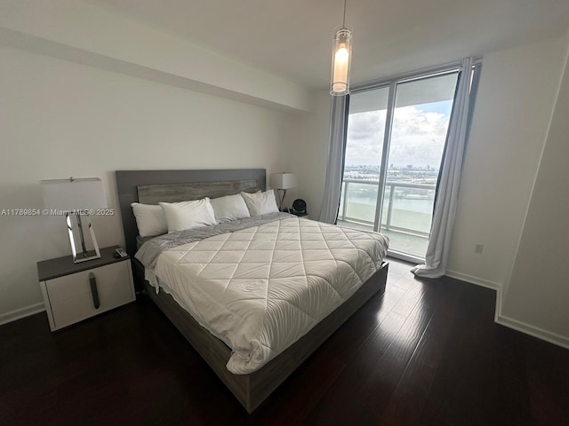 50 Biscayne Blvd Unit 3308, Miami, FL 33132 - bedroom with floor to ceiling windows, dark wood finished floors, baseboards, and access to exterior