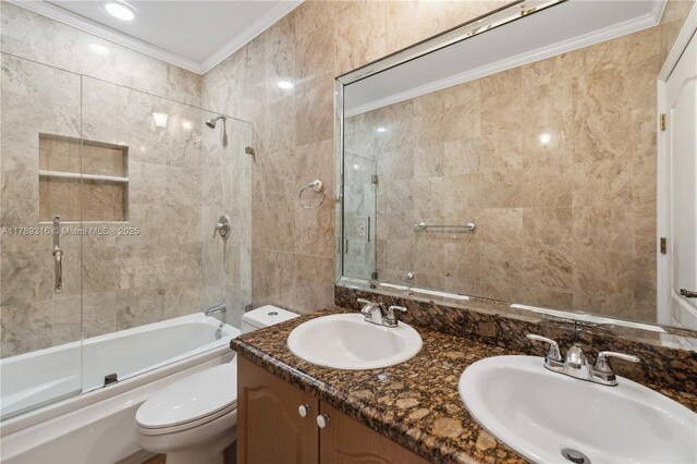 105 S Royal Poinciana Blvd, Miami Springs, FL 33166 - bathroom featuring bath / shower combo with glass door, toilet, crown molding, and a sink
