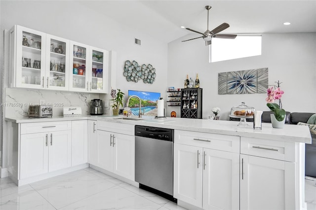 1543 NW 182nd Way, Pembroke Pines, FL 33029 - kitchen with stainless steel dishwasher, a peninsula, ceiling fan, high vaulted ceiling, and light stone counters