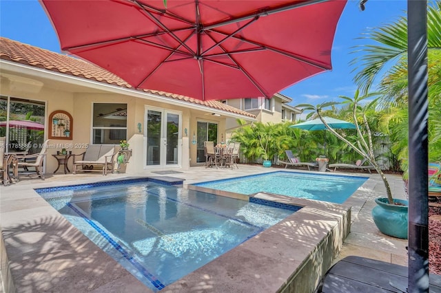 1543 NW 182nd Way, Pembroke Pines, FL 33029 - view of swimming pool with french doors, a patio area, outdoor dining area, and a pool with connected hot tub