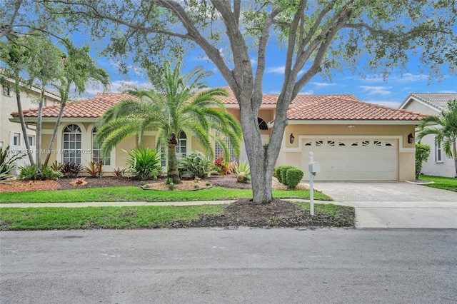 1543 NW 182nd Way, Pembroke Pines, FL 33029 - mediterranean / spanish-style house with stucco siding, a tiled roof, concrete driveway, and an attached garage