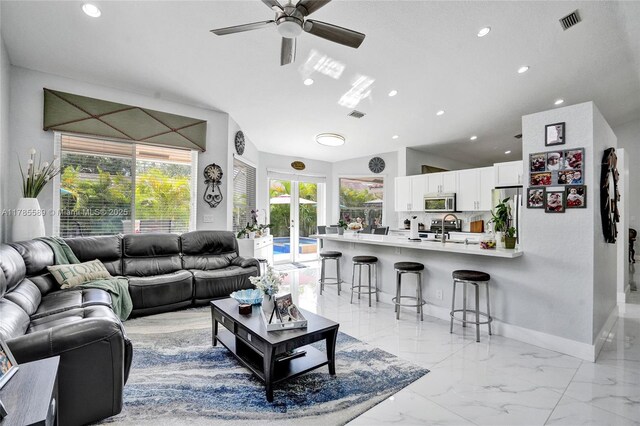 1543 NW 182nd Way, Pembroke Pines, FL 33029 - living room with recessed lighting, a ceiling fan, vaulted ceiling, and light marble finish floors