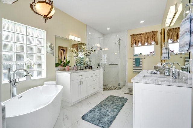 1543 NW 182nd Way, Pembroke Pines, FL 33029 - bathroom with a stall shower, two vanities, a freestanding bath, healthy amount of natural light, and recessed lighting