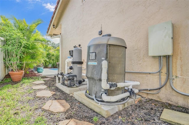 1543 NW 182nd Way, Pembroke Pines, FL 33029 - exterior view of stucco siding and pump