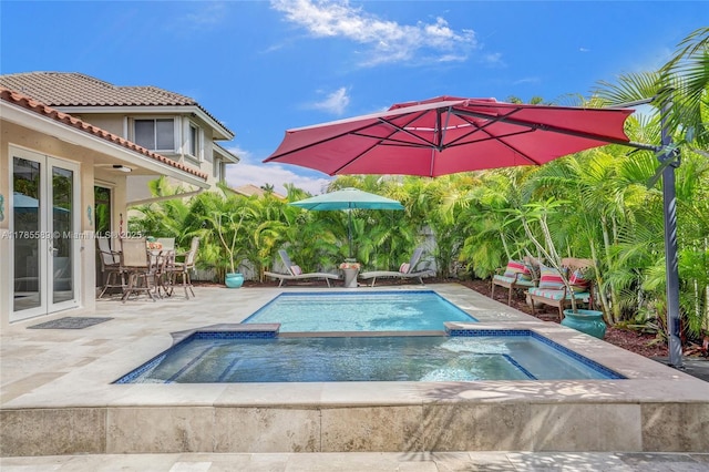 1543 NW 182nd Way, Pembroke Pines, FL 33029 - swimming pool with an in-ground hot tub, a patio, and french doors