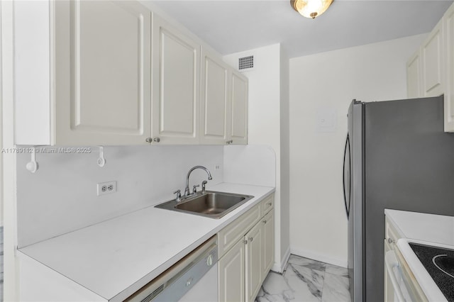 kitchen featuring a sink, white dishwasher, marble finish floor, visible vents, and light countertops