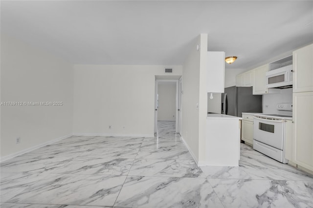 kitchen featuring visible vents, baseboards, open floor plan, white appliances, and marble finish floor