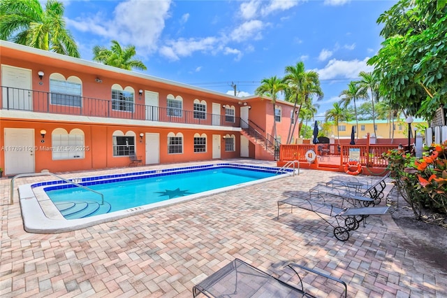 pool with a patio