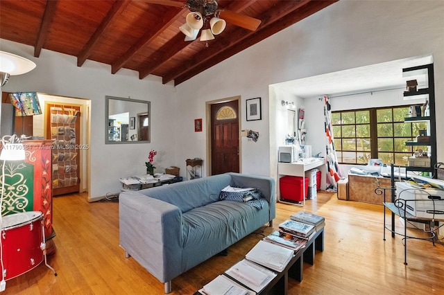 living area featuring wooden ceiling, wood finished floors, beam ceiling, high vaulted ceiling, and a ceiling fan