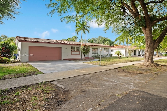 14515 Mahogany Ct, Miami Lakes, FL 33014 - single story home with an attached garage, concrete driveway, a tile roof, and stucco siding