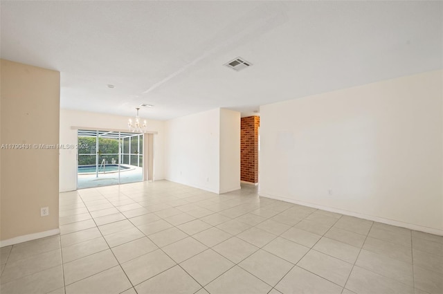 14515 Mahogany Ct, Miami Lakes, FL 33014 - unfurnished room featuring visible vents, baseboards, light tile patterned floors, and a notable chandelier