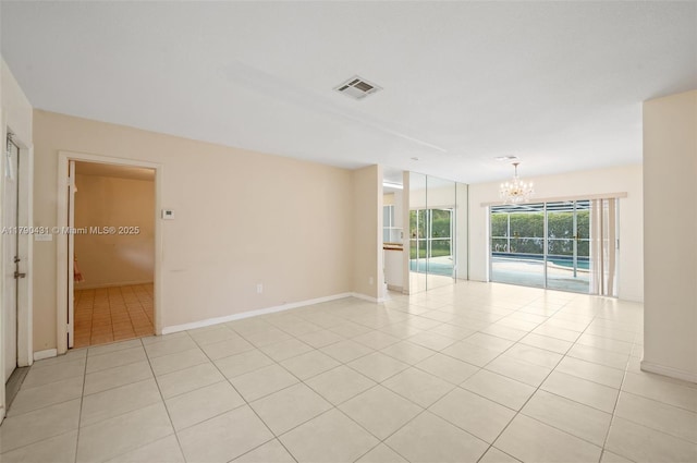 14515 Mahogany Ct, Miami Lakes, FL 33014 - spare room featuring an inviting chandelier, light tile patterned floors, baseboards, and visible vents