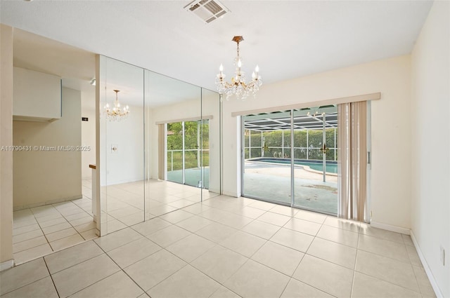 14515 Mahogany Ct, Miami Lakes, FL 33014 - unfurnished dining area with tile patterned flooring, visible vents, baseboards, and a chandelier