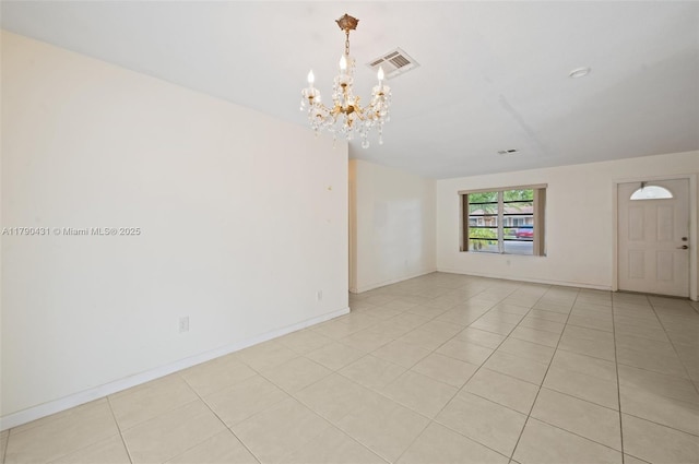 14515 Mahogany Ct, Miami Lakes, FL 33014 - spare room with visible vents, baseboards, light tile patterned floors, and a notable chandelier