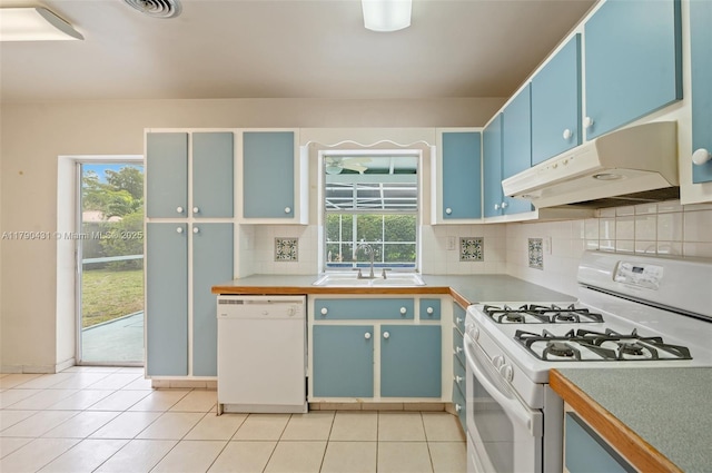 14515 Mahogany Ct, Miami Lakes, FL 33014 - kitchen featuring white appliances, under cabinet range hood, blue cabinets, a sink, and backsplash