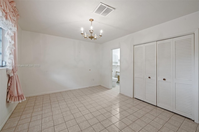 14515 Mahogany Ct, Miami Lakes, FL 33014 - unfurnished bedroom with visible vents, baseboards, a closet, a notable chandelier, and light tile patterned flooring