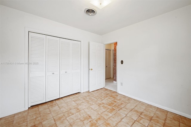 14515 Mahogany Ct, Miami Lakes, FL 33014 - unfurnished bedroom with baseboards, a closet, and visible vents