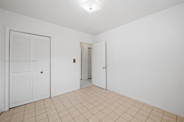 14515 Mahogany Ct, Miami Lakes, FL 33014 - unfurnished bedroom featuring baseboards and a closet