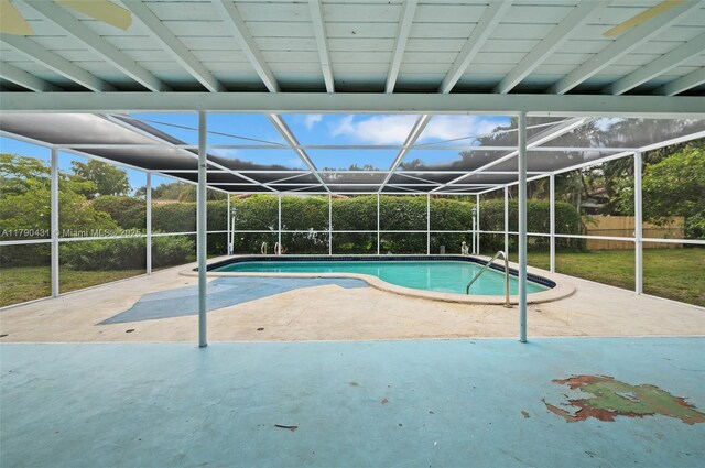 14515 Mahogany Ct, Miami Lakes, FL 33014 - outdoor pool with a fenced backyard, a patio, and glass enclosure