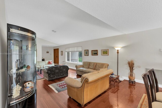1800 NW 105th Ln, Coral Springs, FL 33071 - living area with wood finished floors, visible vents, vaulted ceiling, and baseboards