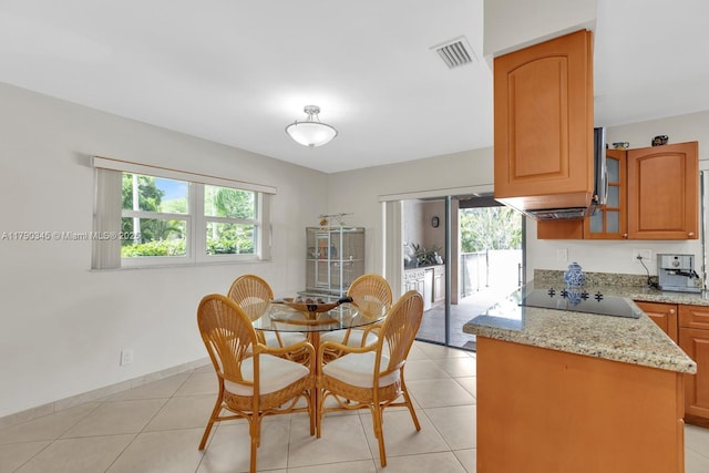 1800 NW 105th Ln, Coral Springs, FL 33071 - dining space featuring light tile patterned floors, visible vents, and plenty of natural light