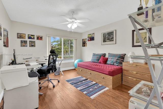 1800 NW 105th Ln, Coral Springs, FL 33071 - bedroom with a textured ceiling, a ceiling fan, and wood finished floors