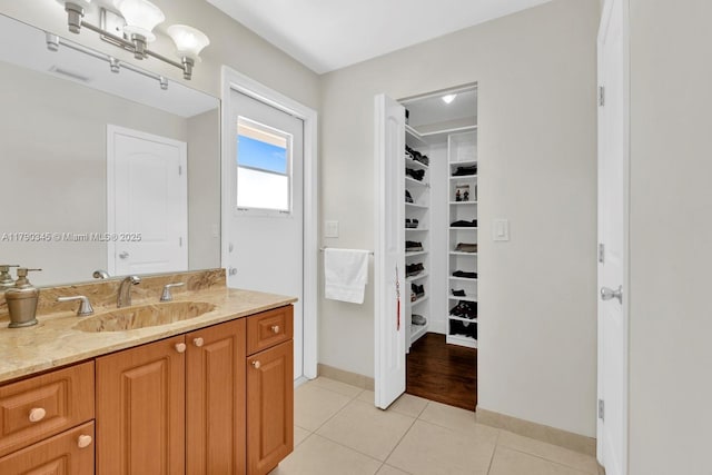 1800 NW 105th Ln, Coral Springs, FL 33071 - full bath featuring vanity, visible vents, baseboards, tile patterned floors, and a spacious closet