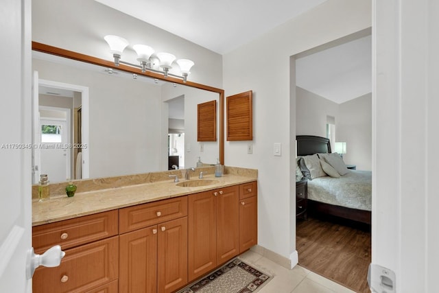 1800 NW 105th Ln, Coral Springs, FL 33071 - ensuite bathroom with vanity, connected bathroom, tile patterned flooring, and baseboards