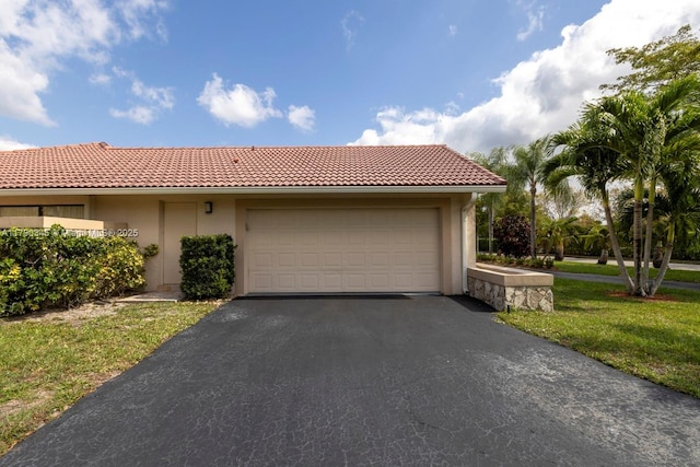 1800 NW 105th Ln, Coral Springs, FL 33071 - view of front facade with a garage, aphalt driveway, stucco siding, and a tiled roof
