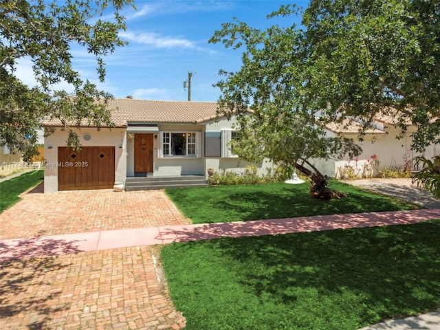 1185 Biarritz Dr, Miami Beach, FL 33141 - single story home with a front lawn, stucco siding, and a tile roof