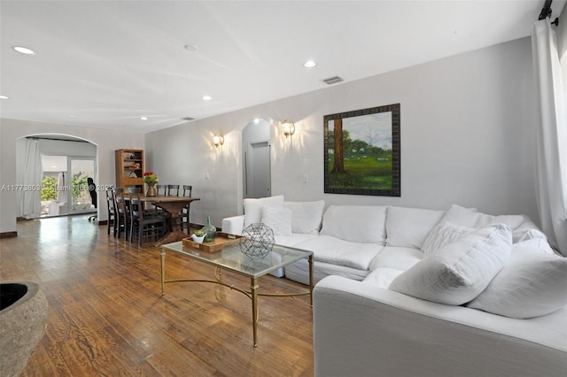 1185 Biarritz Dr, Miami Beach, FL 33141 - living area with arched walkways, visible vents, recessed lighting, and wood finished floors