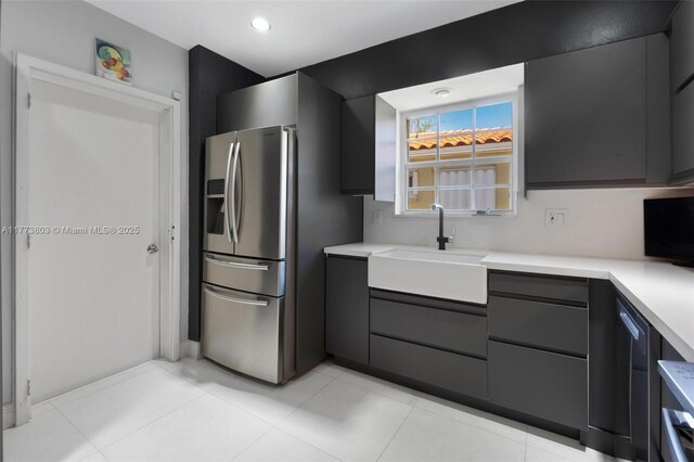 1185 Biarritz Dr, Miami Beach, FL 33141 - kitchen with gray cabinetry, light countertops, modern cabinets, and a sink