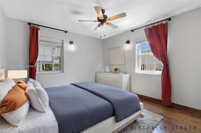 1185 Biarritz Dr, Miami Beach, FL 33141 - bedroom featuring ceiling fan, baseboards, and hardwood / wood-style floors