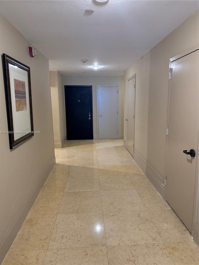 1420 Brickell Bay Dr Unit 103A1, Miami, FL 33131 - hallway with baseboards