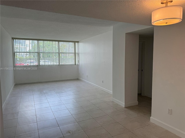 1420 Brickell Bay Dr Unit 103A1, Miami, FL 33131 - unfurnished room featuring light tile patterned flooring and baseboards