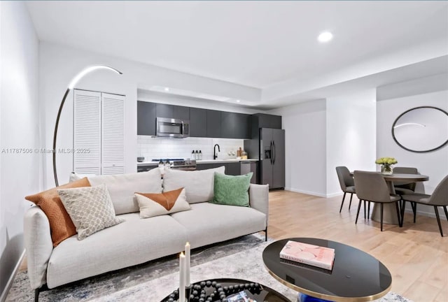 398 NE 5th St Unit 1515, Miami, FL 33132 - living room with recessed lighting, baseboards, and light wood-type flooring