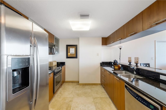 1800 N Bayshore Dr Unit 509, Miami, FL 33132 - kitchen with appliances with stainless steel finishes, brown cabinets, and dark stone counters