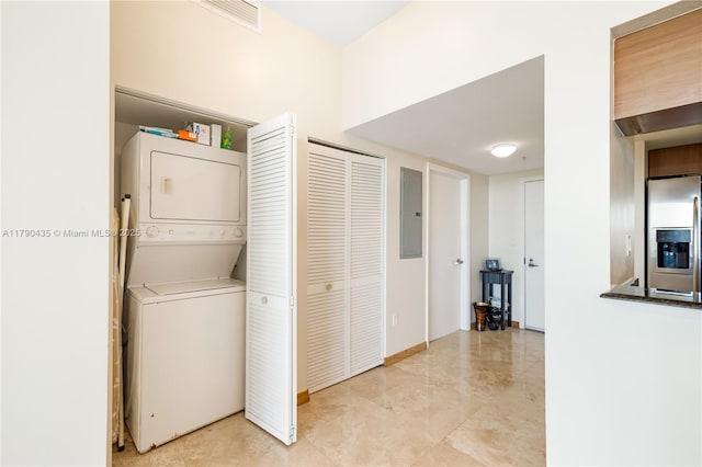 1800 N Bayshore Dr Unit 509, Miami, FL 33132 - washroom featuring stacked washer / dryer and electric panel