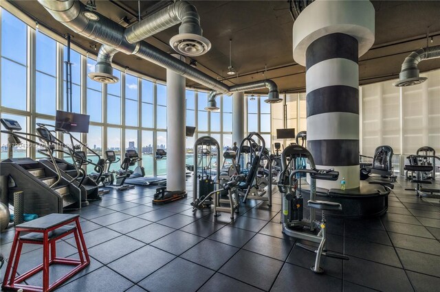 1800 N Bayshore Dr Unit 509, Miami, FL 33132 - gym featuring floor to ceiling windows and a high ceiling