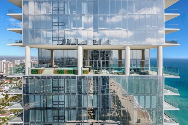 view of building exterior with a water view