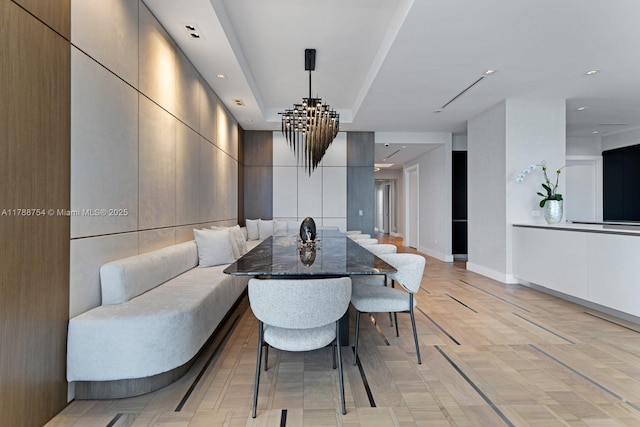dining area with recessed lighting, baseboards, and a notable chandelier