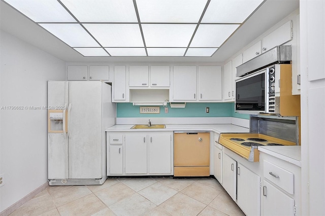 11930 N Bayshore Dr Unit 1007, North Miami, FL 33181 - kitchen with light tile patterned floors, light countertops, a sink, and white appliances