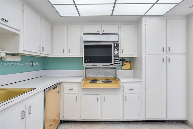 11930 N Bayshore Dr Unit 1007, North Miami, FL 33181 - kitchen with dishwashing machine, light countertops, and white cabinetry