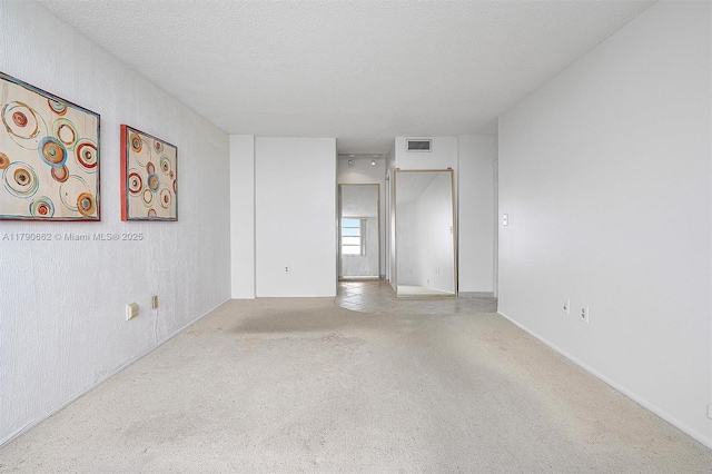 11930 N Bayshore Dr Unit 1007, North Miami, FL 33181 - unfurnished room featuring a textured ceiling, visible vents, and carpet