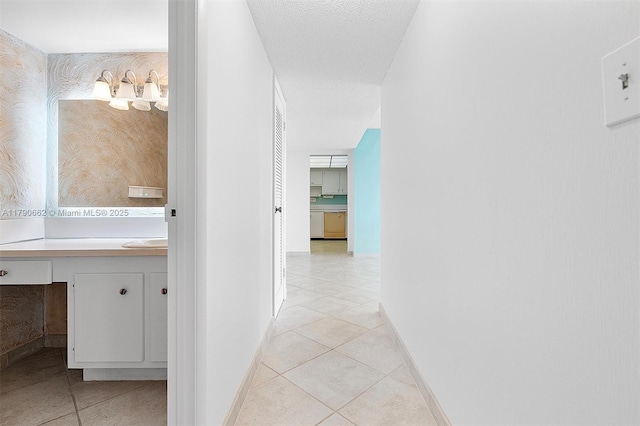 11930 N Bayshore Dr Unit 1007, North Miami, FL 33181 - corridor featuring light tile patterned floors and baseboards