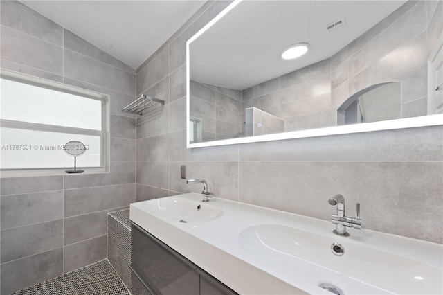 920 Scarlet Oak Ter, Hollywood, FL 33019 - full bathroom with double vanity, visible vents, tile walls, a tile shower, and a sink