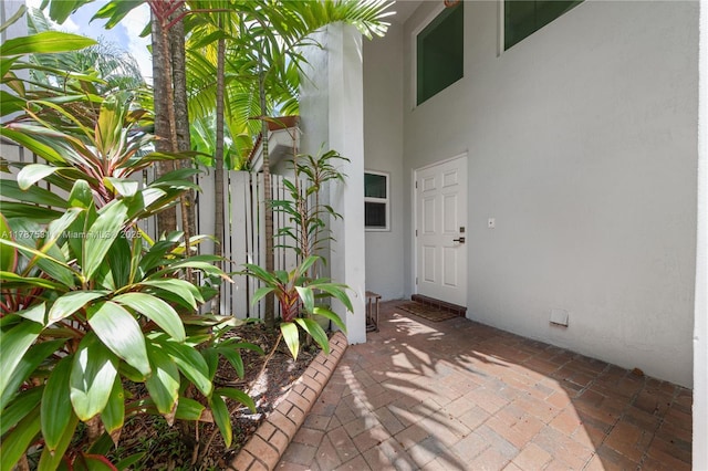 view of exterior entry with stucco siding