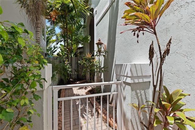 exterior space with fence and stucco siding