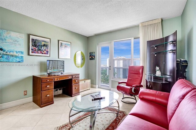 3500 Galt Ocean Dr Unit 1007, Fort Lauderdale, FL 33308 - living room featuring baseboards, a textured ceiling, and light tile patterned flooring