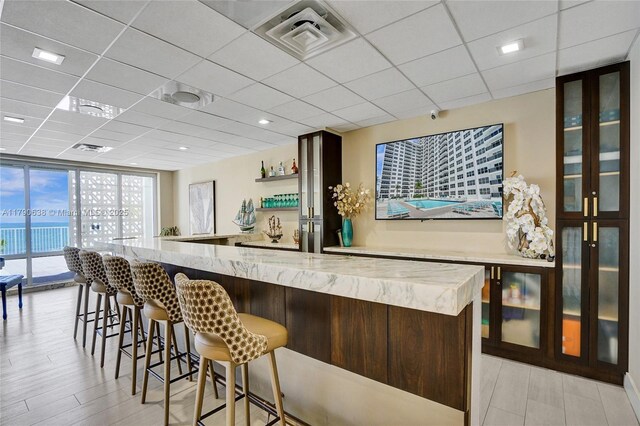 3500 Galt Ocean Dr Unit 1007, Fort Lauderdale, FL 33308 - bar with visible vents, wet bar, and a paneled ceiling